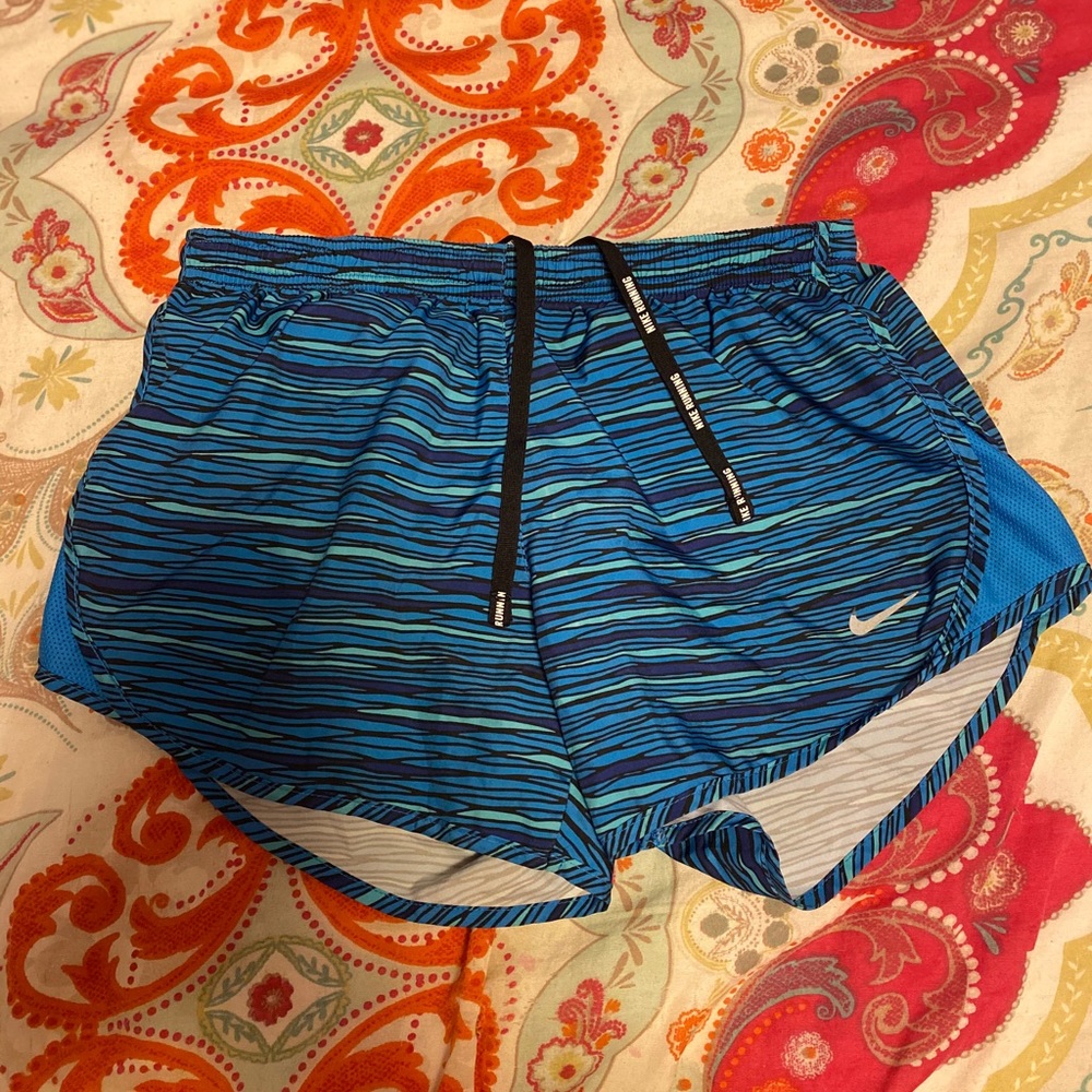 Blue Nike running shorts
